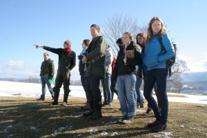 Topher Sabot '99 surveys the pastures with students.