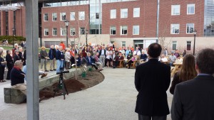 A crowd gathers for the building's dedication. (Photo taken from under the building's pergola.)