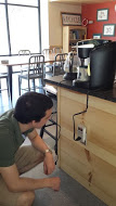 Julio does research on the Keurig Machine to analyze its energy efficiency.