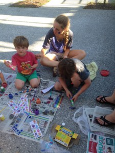 Garden Intern Michelle Buncke works on arts & crafts with kids while a tour of the Environmental Center is given