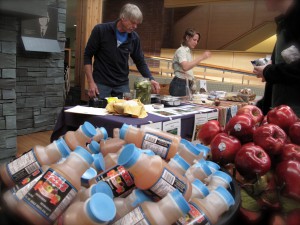 Local apple cider and apples with Bill Stinson from Peace Valley Farm in the background.  Photo credit - Celeste Berg
