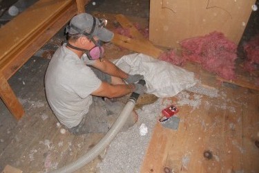 Spaces beneath floorboards in the Oakley Center's attic were packed with cellulose.
