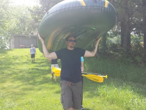 justin carrying raft