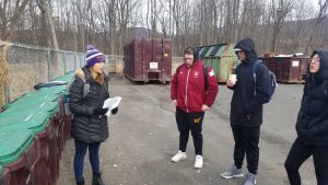 Sustainability Tour of Campus - Korinna Garfield '19 - at the compost storage area