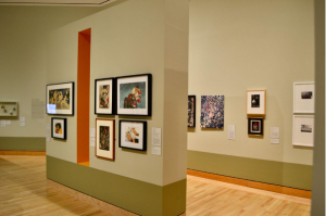 Image of gallery wall with numerous small pieces of art