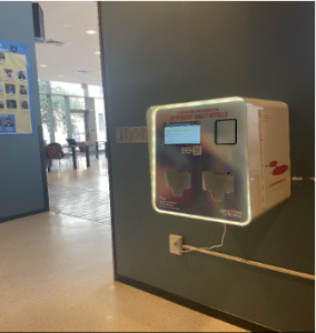 Square GenCo dispenser box sits mounted on a wall