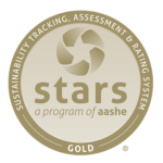 Gold-colored badge that says "Sustainability Tracking, Assessment and Rating System Gold" stars, a program of aashe