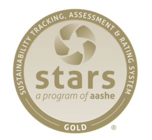 Gold-colored badge that says "Sustainability Tracking, Assessment and Rating System Gold" stars, a program of aashe