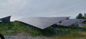 Four rows of solar photovoltaic panels at the Farmington Solar project.