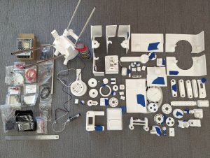 Miscellaneous polyformer printer parts on a table