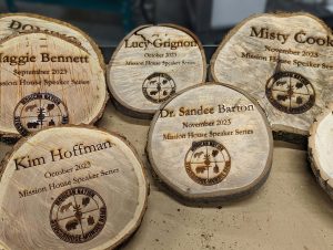 Engraved wooden nameplates on wood cookies