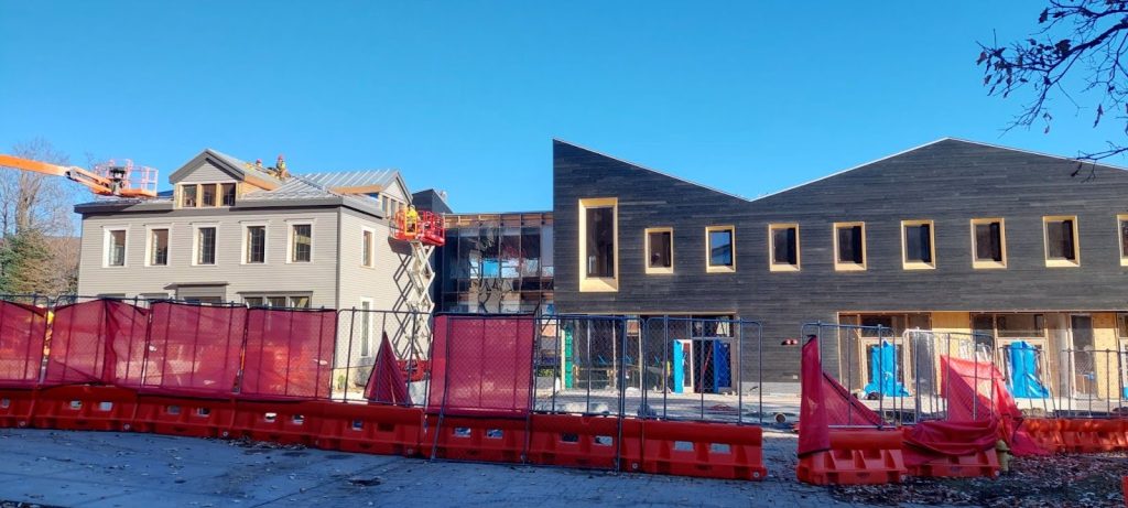 The view of Rice House and the Rice addition from in front of Wacheheim. Rice’s hip roof can be seen as well as the bold roofline of the Rice addition.