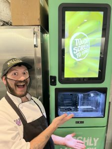 Nick Illich, Snack Bar Attendant at Late Night in front of the Fresh Blends machine
