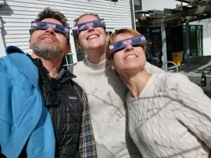 Mike. Christine, Tanja wearing eclipse goggles while watching the eclipse